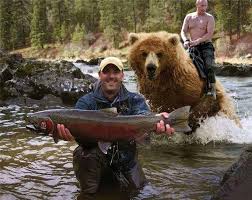 PsBattle: Man holding fish while bear stands behind him : r ...