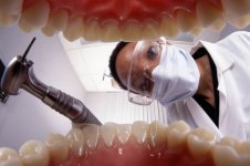 Dentist+working+on+a+patient.jpg