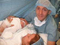 Brianne holding Declan for the first time and tears in Shanes eyes.gif