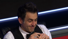 ronnie smiling on rail.png
