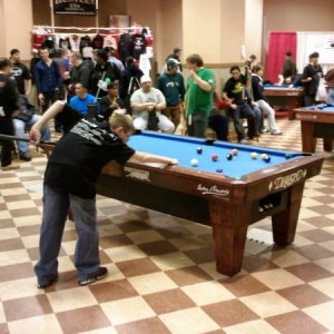 My 11 y.o. son on the "Practice Tables" ...haha...at the Valley Forge Super Billiard Expo 2009