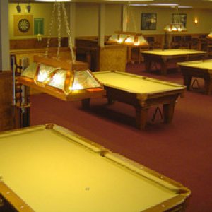 Upscale yet casual and fun atmosphere.   Eleven oak pool tables.