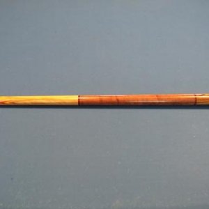 Kilby cue. Simple, but with nice wood selection.. And it plays like a dream...