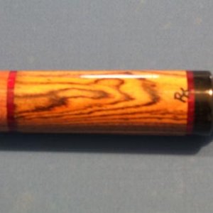 Highly figured Bocote butt. The rings are 50 year old phenolic!!!!