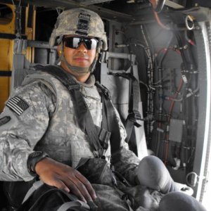 DSCF0187 Me catching a ride on a blackhawk, notice my pool case under my right hand lol.