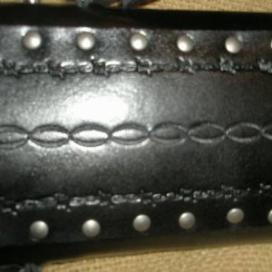 Tooling on back strap