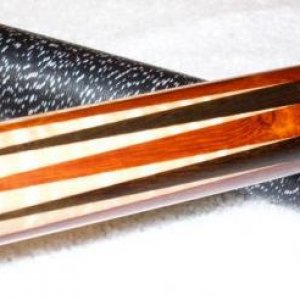 1995 Dave Tice... Dave made the cue for me in 95,
12pt  African Padauk / Black Limba with eastern fiddle back maple forearm.  Dave Jones refinished th