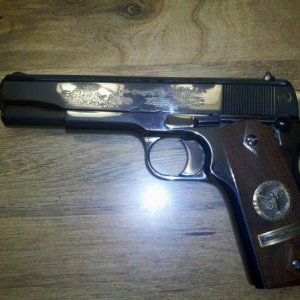Colt Commemoritive from the 60s.The bluing was flawless and never a mal function........................
