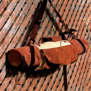 This is one of the Quiver collection.....made of deerskin with 3X6 capacity, custom ordered jumpstick bag, no handle but has an adjustable strap, padd