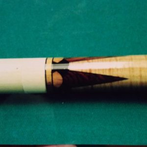 Four point Cocobolo against curly cherry, ebony and olive wood dots with Koa rings.
