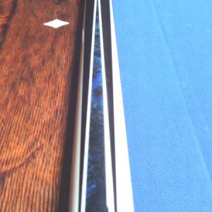 Dave Jones
The blue inlay is pressure stained Madrona Burrell.
everything that is white in the cue is real ivory. 
Stack layered leather wrap.
it play