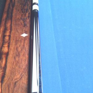 Dave Jones
The blue inlay is pressure stained Madrona Burrell.
everything that is white in the cue is real ivory. 
Stack layered leather wrap.
it play