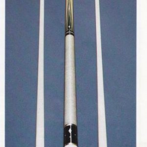In the spring of '91, I was reading an article on collectible pool cues in the current issue of "Snap" magazine, and this picture was included as an e