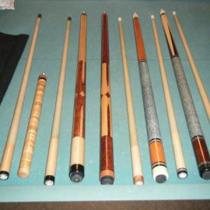 left to right 
zimmerman custom jump cue
zimmerman custom break cue
chris' cue (made by chris whittaker)
durbin custom (made for mark wilson)
durbin c