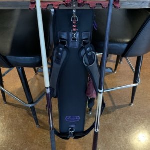 Case hanging from cue rest