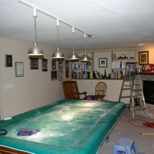 In this photo, where the step-ladder is, a recessed lamp is in the ceiling in front of the fireplace.  You'd think I could have tied into this as an e