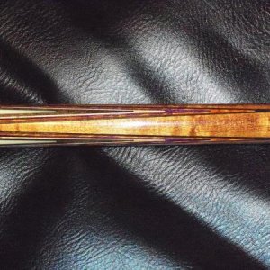 Joss 95-09 Forearm: Triangle inlay, Black, Natural, Purple, Brown, & Black veneers in the points.
20.4 ounce cue; no weight bolt. I have a Predator Z 