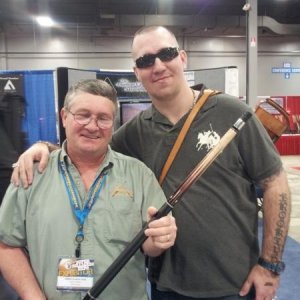 Andy Gilbert and I holding his first 8 point cue he made in 2001 at the SBE 2013