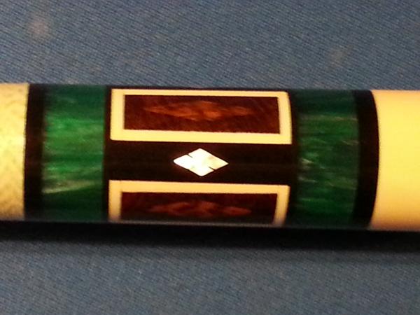 1371962556352two emerald rings snake wood (diamond inside rectangle) ivory surrounding and ivory butt and ivory ring below wrap and 4 mop diamods inla