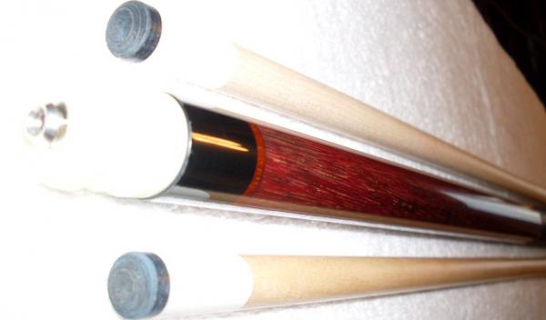 1992 Dave Tice. 
Purple heart with African Padauk rings. 
Cue refinished by Dave Jones custom cues