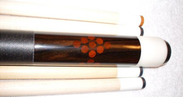 1995 Dave Tice. 
Dave made the cue for me in 95, 
The rack of nine in the butt is African Padauk and ebony.
The butt cap is Delran, its original,  Too