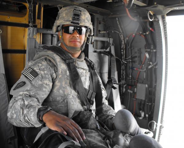 DSCF0187 Me catching a ride on a blackhawk, notice my pool case under my right hand lol.