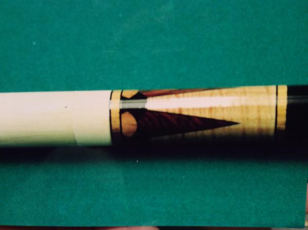 Four point Cocobolo against curly cherry, ebony and olive wood dots with Koa rings.