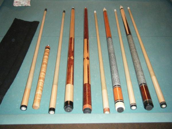 left to right 
zimmerman custom jump cue
zimmerman custom break cue
chris' cue (made by chris whittaker)
durbin custom (made for mark wilson)
durbin c