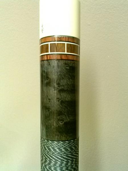 Minor figured Birdseye and Charcoal stain. Medium Rosewood or Bubinga? rings and Dark Cocobolo Core ring. Finish lift on the Phenolic.