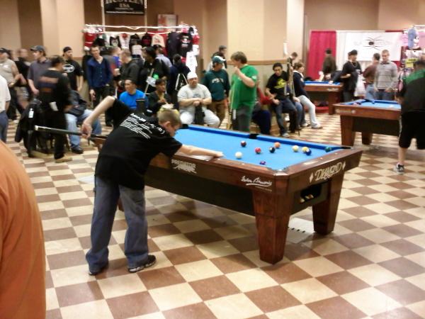 My 11 y.o. son on the "Practice Tables" ...haha...at the Valley Forge Super Billiard Expo 2009