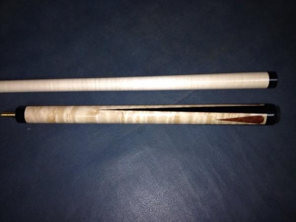 This is a jump cue I made to match a shooter for Ryan Sauer.  Birdseye Maple with ebony points, and smaller redwood burl points.  Another cue that jum