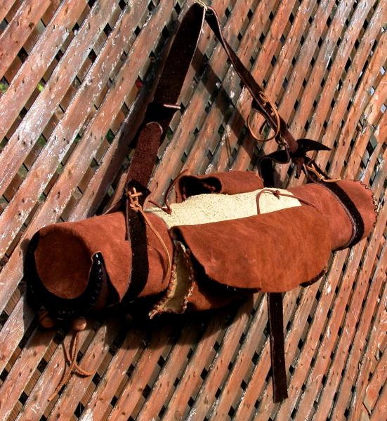 This is one of the Quiver collection.....made of deerskin with 3X6 capacity, custom ordered jumpstick bag, no handle but has an adjustable strap, padd
