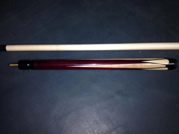 This was a jump cue made to match a cue I made for Chris Giarde.  This is purpleheart, with curly maple points, and faux ivory points with a single bl