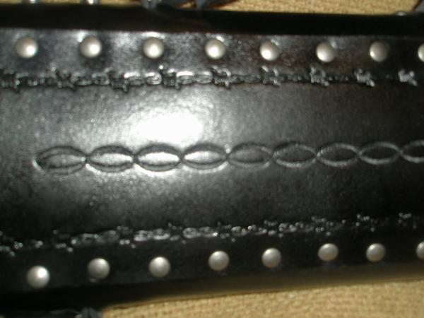Tooling on back strap